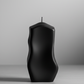 Matte black sculptural pillar candle
